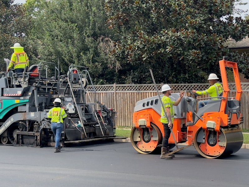 Crew sealing cracks on an asphalt surface